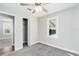 Well-lit bedroom featuring carpet, ceiling fan and closet at 1317 W Belmar St, Lakeland, FL 33815