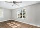 Bright bedroom with large window, wood floors, and ceiling fan at 1317 W Belmar St, Lakeland, FL 33815