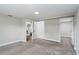 Spacious bedroom with neutral carpeting and access to laundry at 1317 W Belmar St, Lakeland, FL 33815