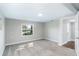 Bright bedroom with neutral carpeting and large window at 1317 W Belmar St, Lakeland, FL 33815