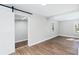 Bright dining room with hardwood floors and barn door at 1317 W Belmar St, Lakeland, FL 33815