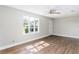 Spacious living room with wood floors and large window at 1317 W Belmar St, Lakeland, FL 33815