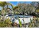 Inviting above-ground pool surrounded by lush landscaping at 1317 W Belmar St, Lakeland, FL 33815