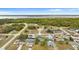 Aerial view of a house near a lake in a residential area at 1405 Kissimmee Dr, Kissimmee, FL 34759