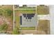 Aerial view of a house with solar panels on the roof at 1405 Kissimmee Dr, Kissimmee, FL 34759