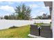 Backyard with patio furniture and privacy fence at 1405 Kissimmee Dr, Kissimmee, FL 34759