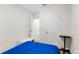 Bedroom with blue bedspread and access to a hallway at 1405 Kissimmee Dr, Kissimmee, FL 34759