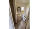 Small bathroom with toilet, sink, and shower at 1408 28Th Nw St, Winter Haven, FL 33881