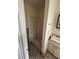 Small bathroom with shower and sink at 1408 28Th Nw St, Winter Haven, FL 33881