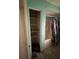 Bathroom with bathtub, shower, and shelving at 1408 28Th Nw St, Winter Haven, FL 33881