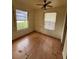 Bedroom with ceiling fan and hardwood floors at 1408 28Th Nw St, Winter Haven, FL 33881