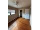 Hardwood floor bedroom with window and closet at 1408 28Th Nw St, Winter Haven, FL 33881