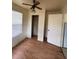 Bedroom with ceiling fan and closet at 1408 28Th Nw St, Winter Haven, FL 33881