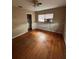 Hardwood floor bedroom with window and closet at 1408 28Th Nw St, Winter Haven, FL 33881