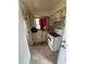 Small kitchen with stove and cabinets at 1408 28Th Nw St, Winter Haven, FL 33881