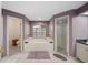 Primary bathroom with a large tub, separate shower, and double vanity at 1423 Royal Forest Loop, Lakeland, FL 33811