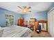 Bedroom with a queen bed and ceiling fan at 1423 Royal Forest Loop, Lakeland, FL 33811