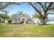 Charming one-story house with a swing and well-manicured lawn at 1423 Royal Forest Loop, Lakeland, FL 33811