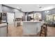 Modern kitchen with white cabinets, gray walls, and breakfast bar at 1423 Royal Forest Loop, Lakeland, FL 33811