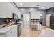 Modern kitchen with white cabinets, gray walls, and ample counter space at 1423 Royal Forest Loop, Lakeland, FL 33811