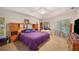 Large main bedroom with a king-size bed and built-in shelving at 1423 Royal Forest Loop, Lakeland, FL 33811