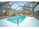 Relaxing screened pool and spa with ample deck space at 1423 Royal Forest Loop, Lakeland, FL 33811