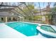 Inviting screened pool and spa, perfect for relaxation at 1423 Royal Forest Loop, Lakeland, FL 33811