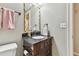 Small bathroom with dark vanity and updated fixtures at 1521 Leighton Ave, Lakeland, FL 33803