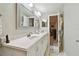 Elegant bathroom with double vanity and access to bedroom at 1521 Leighton Ave, Lakeland, FL 33803