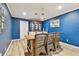 Formal dining room with blue walls and wicker chairs at 1521 Leighton Ave, Lakeland, FL 33803