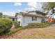 Two-story house with gray brick exterior, attached garage, and landscaped yard at 1521 Leighton Ave, Lakeland, FL 33803