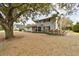 Two-story house with gray brick exterior, landscaped yard, and walkway at 1521 Leighton Ave, Lakeland, FL 33803