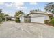 Attached garage with carport and landscaped yard at 1521 Leighton Ave, Lakeland, FL 33803