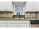 Modern kitchen with granite countertops and a farmhouse sink at 1521 Leighton Ave, Lakeland, FL 33803