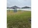 Backyard with playground and grassy area at 1543 Hollow Tree Ct, Lakeland, FL 33811