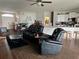 Living room with reclining theater seating and dark floors at 1543 Hollow Tree Ct, Lakeland, FL 33811