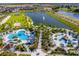 Community pool, water features, and surrounding green areas at 1559 Carey Palm Cir, Kissimmee, FL 34747