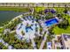 Resort-style pool with water features, playground, and expansive deck at 1559 Carey Palm Cir, Kissimmee, FL 34747