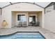 Private pool and patio furniture with a covered lanai at 1559 Carey Palm Cir, Kissimmee, FL 34747