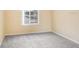 Simple bedroom with grey carpet and window at 16202 Indian Creek Dr # 16202, Kissimmee, FL 34759