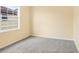 Bright bedroom with grey carpet and large window at 16202 Indian Creek Dr # 16202, Kissimmee, FL 34759