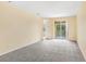 Bright bedroom with neutral walls and carpet, plus sliding glass doors at 16202 Indian Creek Dr # 16202, Kissimmee, FL 34759