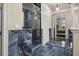 Spa-like bathroom with glass shower and blue marble tile at 1665 Blue Heron Ln, Lakeland, FL 33813