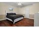 Comfortable bedroom with hardwood floors and a ceiling fan at 1665 Blue Heron Ln, Lakeland, FL 33813