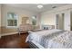 Well-lit bedroom with hardwood floors and built-in shelving at 1665 Blue Heron Ln, Lakeland, FL 33813