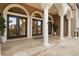 Elegant entryway with arched doorways and columns at 1665 Blue Heron Ln, Lakeland, FL 33813