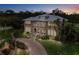 Two-story home with a brick facade and lush landscaping at 1665 Blue Heron Ln, Lakeland, FL 33813