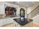 Kitchen with large island, view into Gathering room, and stainless steel appliances at 1665 Blue Heron Ln, Lakeland, FL 33813