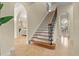 Elegant staircase with wrought iron railing and wooden steps at 1665 Blue Heron Ln, Lakeland, FL 33813