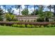 The Estates of Auburndale entrance sign and landscaping at 178 Magneta Loop, Auburndale, FL 33823